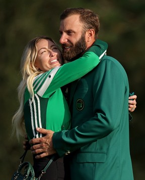 Dustin Johnson of the United States celebrates with Paulina Gretzky of the fiance at the Green Jacket Ceremony after winning the Masters at the Augusta National Golf Club on November 15, 2020 in Augusta, Georgia.