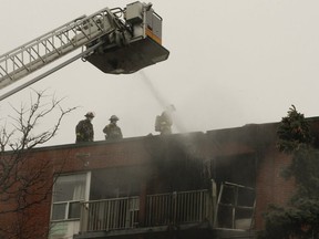 An elderly woman died in a two-alarm fire in her seventh-floor unit at an Etobicoke building.