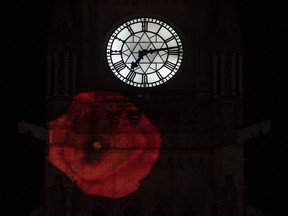 A poppy is projected on the side of the Peace Tower in Ottawa, Monday, Nov. 9, 2020.
