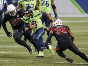 Seattle Seahawks quarterback Russell Wilson runs with the ball against Arizona.