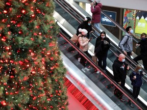This Nov. 21, 2020 file picture shows shoppers wearing mandatory masks at the Eaton Centre before the latest lockdown was imposed.