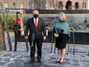 Ontario Premier Doug Ford and Heritage Minister Lisa MacLeod help unveil the new Afghanistan Memorial at Queen’s Park on Remembrance Day, Nov. 11, 2020. twitter.com/allieadamo