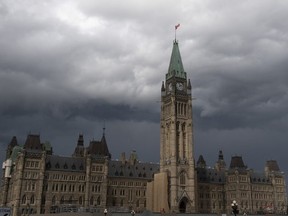 Storm clouds pass by the Peace tower and Parliament Hill on  Aug. 18, 2020.