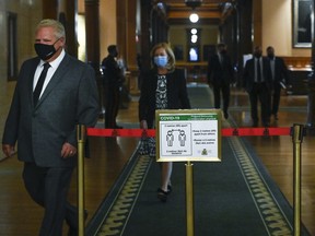 Ontario Premier Doug Ford, followed by Health Minister Christine Elliott, arrives for a news conference at Queen's Park during the COVID-19 pandemic in Toronto on Sept. 28, 2020