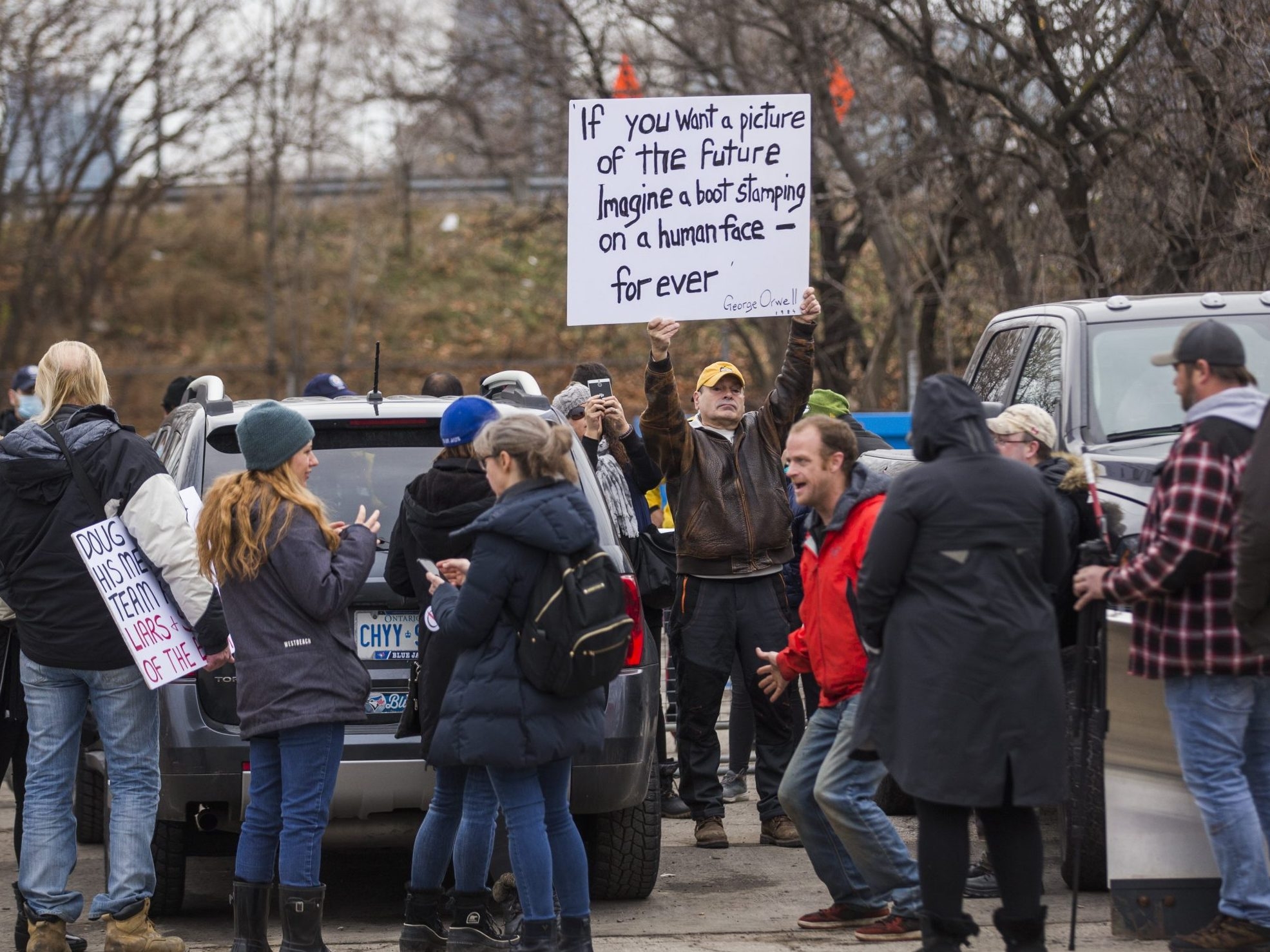  Supporters of Adam Skelly at a closed and boarded up Adamson Barbecue near Royal York and Gardiner Expy in Toronto, Ont. on Friday, November 27, 2020.