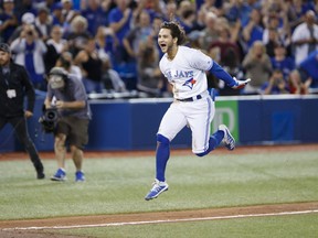 Blue Jays’ Bo Bichette leaps as he head to home plate after hitting a game-winning home run in the 12th inning against the New York Yankees on Sept. 13, 2019 in Toronto. The shortstop is viewed by the organization as a likely Gold Glove winner in the years to come.