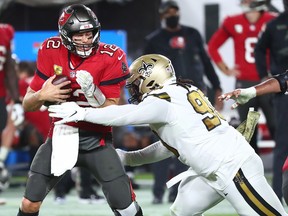 New Orleans Saints defensive tackle Malcom Brown (90) sacks Tampa Bay Buccaneers quarterback Tom Brady (12) at Raymond James Stadium.