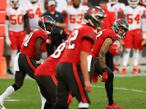 The NFL’s TD-reception leaders since 2014 both play on the Bucs: Antonio Brown (left) and Mike Evans. Getty images