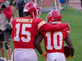 Kansas City Chiefs wide receiver Tyreek Hill (10) celebrates with quarterback Patrick Mahomes (15) after scoring against the Carolina Panthers on Nov. 8, 2020.