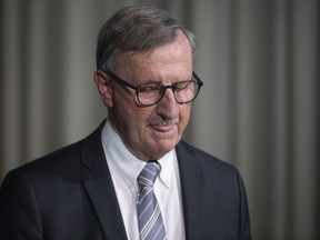 Dr. David Williams, Ontario's chief medical officer of health, looks down during a briefing in Toronto, Friday, Nov, 13, 2020.