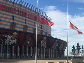 Flags fly at half mast at the Canadian Tire Centre on Nov. 9, 2020 in honour of Alex Trebek who died of pancreatic cancer at the age of 80.