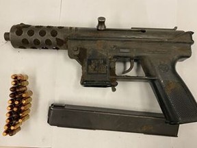 An image released by Toronto Police of a firearm and ammunition allegedly seized during a search warrant on Nov. 2, 2020.