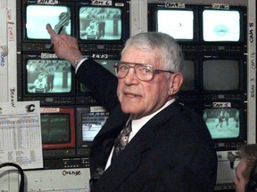Howie Meeker checks out some of the camera shots in the TV truck outside GM Place in Vancouver during a 1998 game, his last telecast before retirement.
