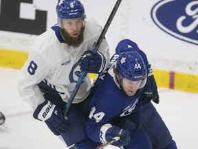 Leafs GM Kyle Dubas had high praise for defenceman Morgan Rielly (right). “On any team, you need a guy who will always put the team ahead of themselves,” he said. Toronto Sun file