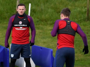 England's striker Wayne Rooney (left) and fellow striker Jamie Vardy attend a training session at St. George's Park in Burton-on-Trent, Nov. 10, 2016.
