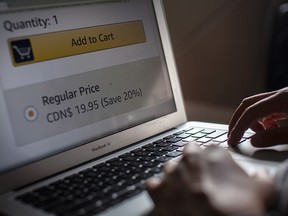 A person browses an e-commerce site on a computer in a photo illustration in Toronto, Wednesday, Oct. 14, 2020.