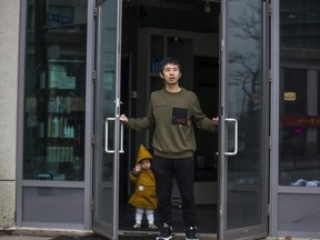 Hao Gao, owner of the closed down Rong Style salon, and his daughter Aria, on Finch Ave. W., near Yonge St. in Toronto, Ont. on Thursday November 26, 2020.