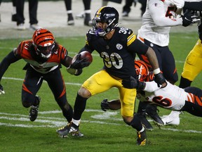 James Conner of the Pittsburgh Steelers rushes with the ball against the Cincinnati Bengals at Heinz Field on Sunday.