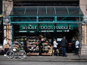 A Whole Foods Market grocery store is shown in Vancouver on Saturday, March 21, 2020.&