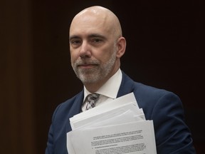 Parliamentary Budget Officer Yves Giroux waits to appear before the Commons Finance committee on Parliament Hill in Ottawa, Tuesday March 10, 2020.