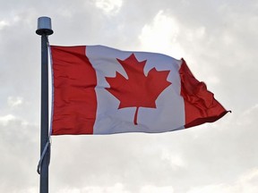 In this file photo taken on July 19, 2015 the Canadian flag flies over the Main Media Center during the 2015 Pan American Games in Toronto, Canada.
