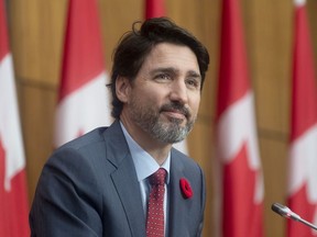 Prime Minister Justin Trudeau listens to a reporters question during a news conference in Ottawa, Tuesday November 10, 2020.