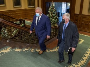 Premier Doug Ford and former head of the Canadian Armed Forces Gen. Rick Hillier (retired) at the Ontario Legislature in Toronto on Friday, Nov. 27, 2020.