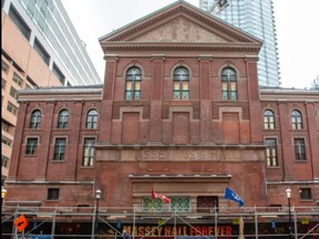 The facade of Massey Hall now reads Massey Music Hall after some stone work and the removal of fire escapes.