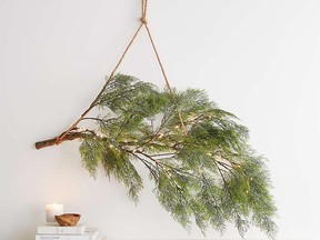 Pre-Lit Hanging Branch Decor from Crate and Barrel retails for $149.95 but is currently on sale for $119.96!