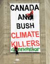 Greenpeace activists Steven Guilbeault, left, and Chris Holden hang from cables near the the top of Toronto’s CN Tower, July 16, 2001.