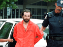 Steven Guilbeault is taken into custody by Toronto Police after scaling the CN Tower in July 2001.