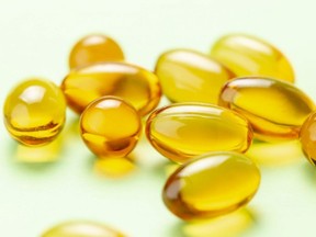 Closeup of Vitamin D3 Omega 3 fish oil capsules.
