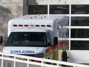 An ambulance waits outside the emergency department of the Victoria General Hospital, which is experiencing an outbreak of COVID-19, in Winnipeg, Nov. 2, 2020.