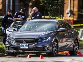 Toronto Police on Patika Ave., west of Merrill Ave., in the Lawrence and Jane area, after a fatal shooting in Toronto, Ont. on Thursday October 1, 2020. Ernest Doroszuk/Toronto Sun/Postmedia
