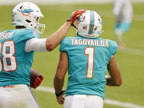 Tight end Mike Gesicki and quarterback Tua Tagovailoa of the Miami Dolphins.