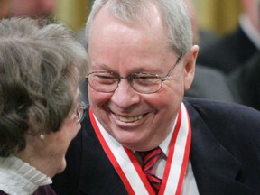 Former Toronto Mayor David Crombie, (right) laughs with Budge Wilson of Halifax, N.S. after receiving the Order of Canada during a ceremony at Rideau Hall in Ottawa, March 11, 2005.