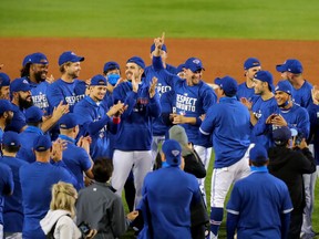 The Toronto Blue Jays celebrate a win against the New York Yankees at Sahlen Field and celebrate a 2020 post-season berth on September 24, 2020 in Buffalo, New York.