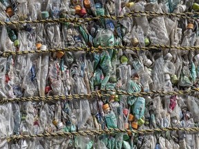 Plastic bottles are compressed into a bale at Asei plastic recycling company on November 5, 2020 in Kasama, Japan.