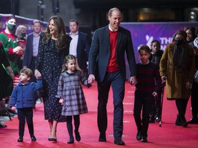 Prince William, Duke of Cambridge and Catherine, Duchess of Cambridge with their children, Prince Louis, Princess Charlotte and Prince George, attend a special pantomime performance at London's Palladium Theatre, hosted by The National Lottery, to thank key workers and their families for their efforts throughout the pandemic on December 11, 2020 in London, England.