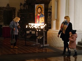 People visit St. Marienkirche Protestant church on Christmas Eve during the second wave of the coronavirus pandemic on Dec. 24, 2020 in Berlin.