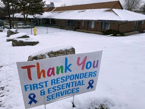 A sign thanking first responders is displayed at the entrance of the ThorntonView, a long term seniors care facility which is the site of a COVID-19 outbreak, in Oshawa, Ont., Dec. 27, 2020.