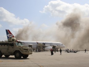 A military vehicle is seen on the tarmac during an attack on Aden airport moments after a plane landed carrying a newly formed cabinet for government-held parts of Yemen, in Aden, Yemen Dec. 30, 2020.