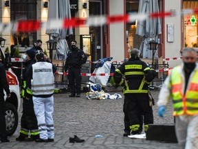 Police and ambulances work at the scene where a car drove into pedestrians in Trier, southwestern Germany, on December 1, 2020.