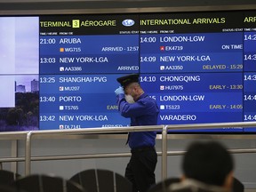 Flights arrive at Pearson International Airport's Terminal 3.