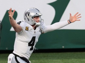 Las Vegas Raiders quarterback Derek Carr celebrates after throwing a game-winning touchdown pass to wide receiver Henry Ruggs III against the New York Jets on Dec. 6, 2020.