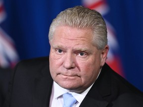 Ontario Premier Doug Ford holds a press conference at Queen's Park during the COVID-19 pandemic in Toronto on Monday, December 21, 2020.