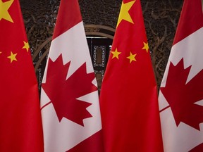 Canadian and Chinese flags are seen prior to a meeting with Canada's Prime Minister Justin Trudeau and China's President Xi Jinping at the Diaoyutai State Guesthouse in Beijing, Dec. 5, 2017.