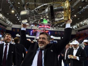 Mike Pelino hoists the Gagarin Cup in 2014.