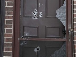 A man with a shotgun blasted the front door of a home in a townhouse complex on Sweet Pea Path, in Etobicoke, on Christmas morning, Dec. 25, 2020.
