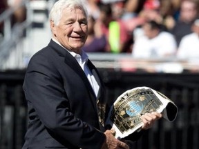 WWE hall of famer Pat Patterson, with the championship he made famous, the WWE Intercontinental Championship.